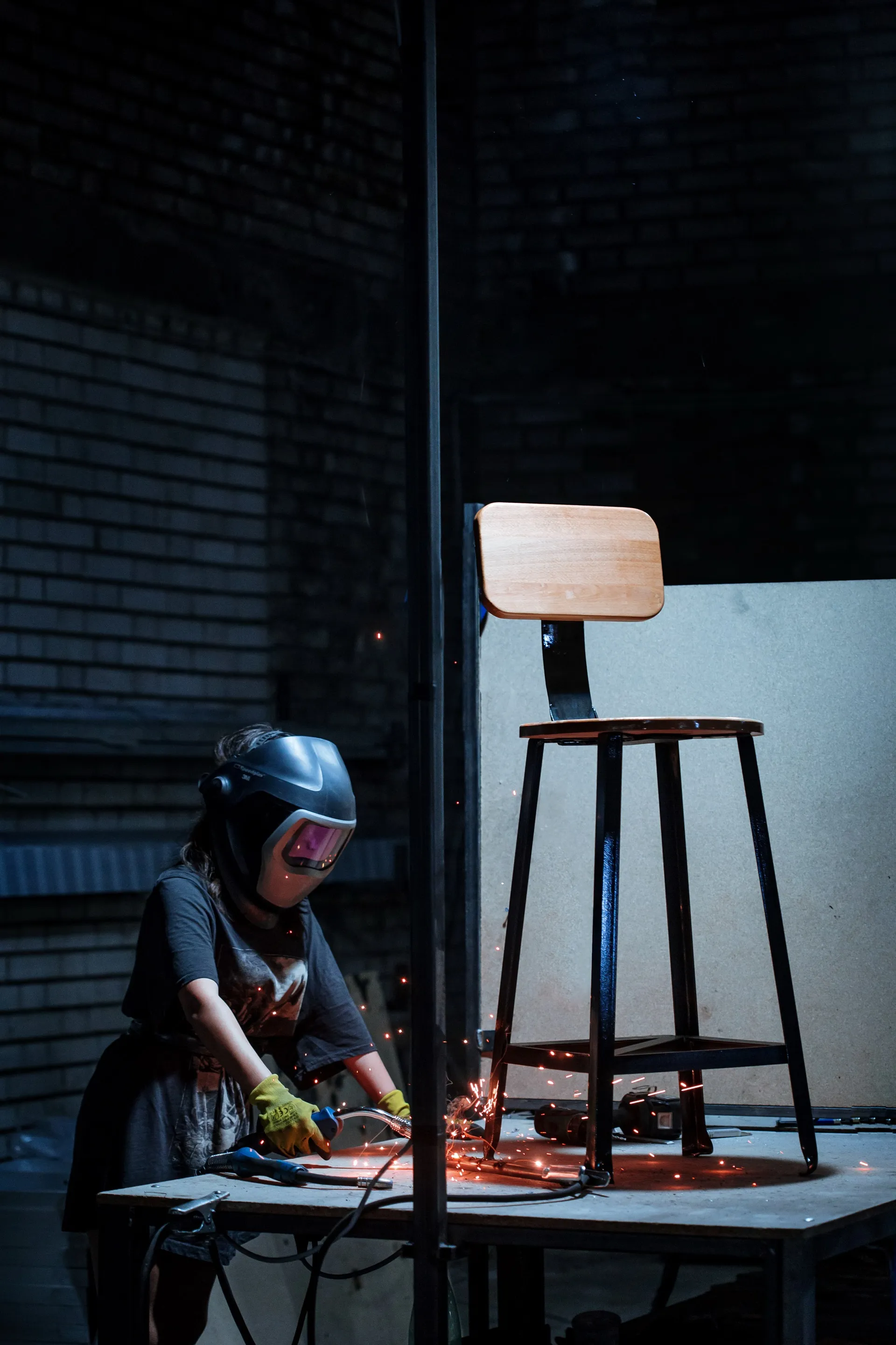 Welder performing maintenance work in a workshop