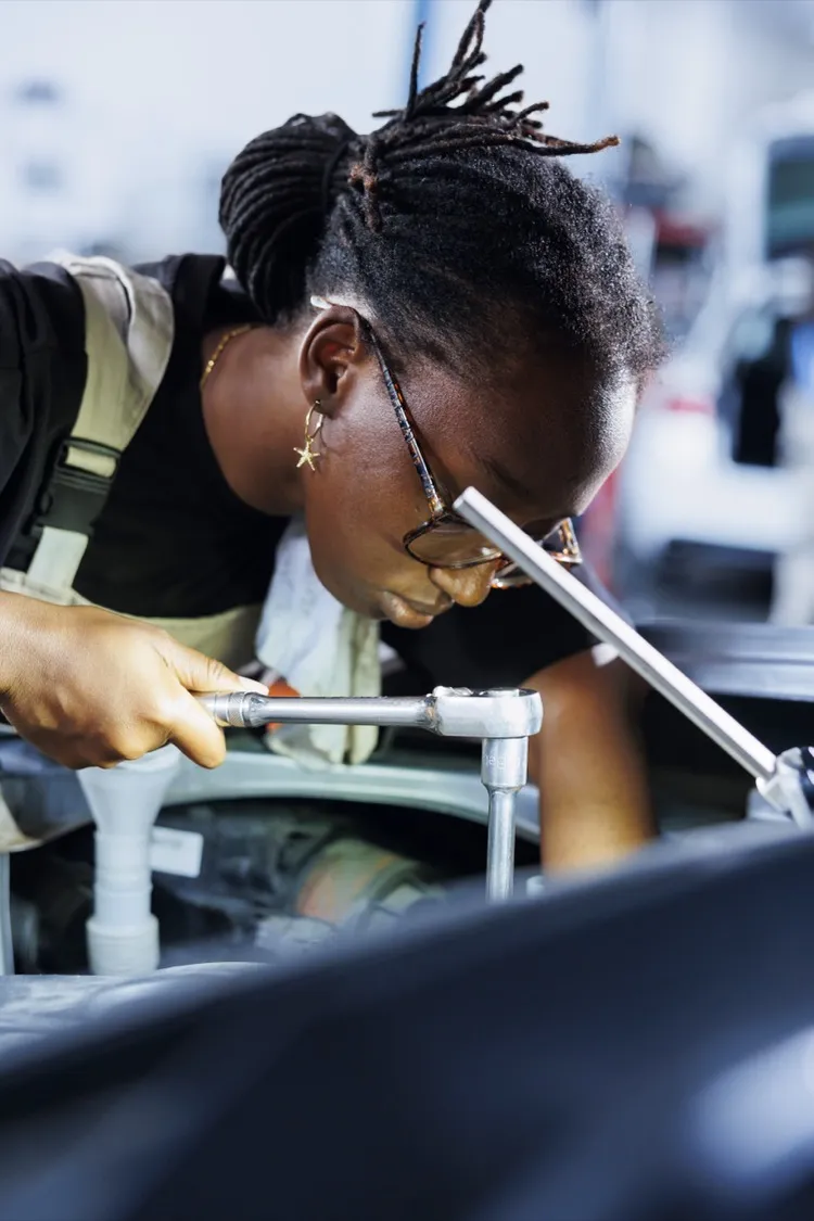 Worker setting up production line at food processing plant