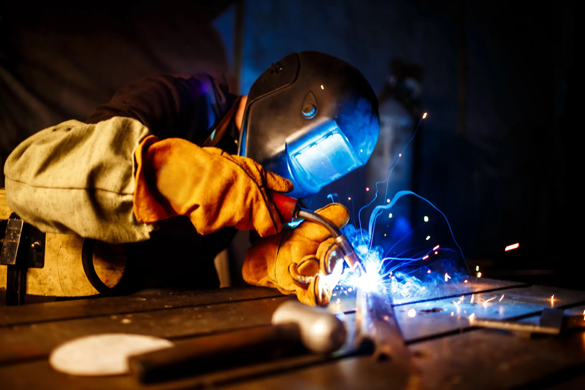 Plasma cutting metal at industrial plant
